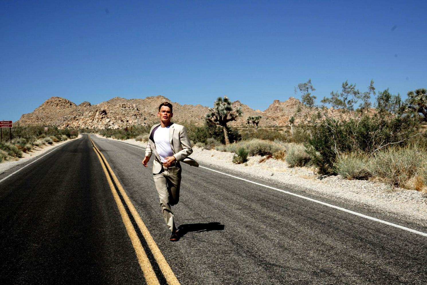 CrossFit athlete demonstrating proper squat form with coach supervision