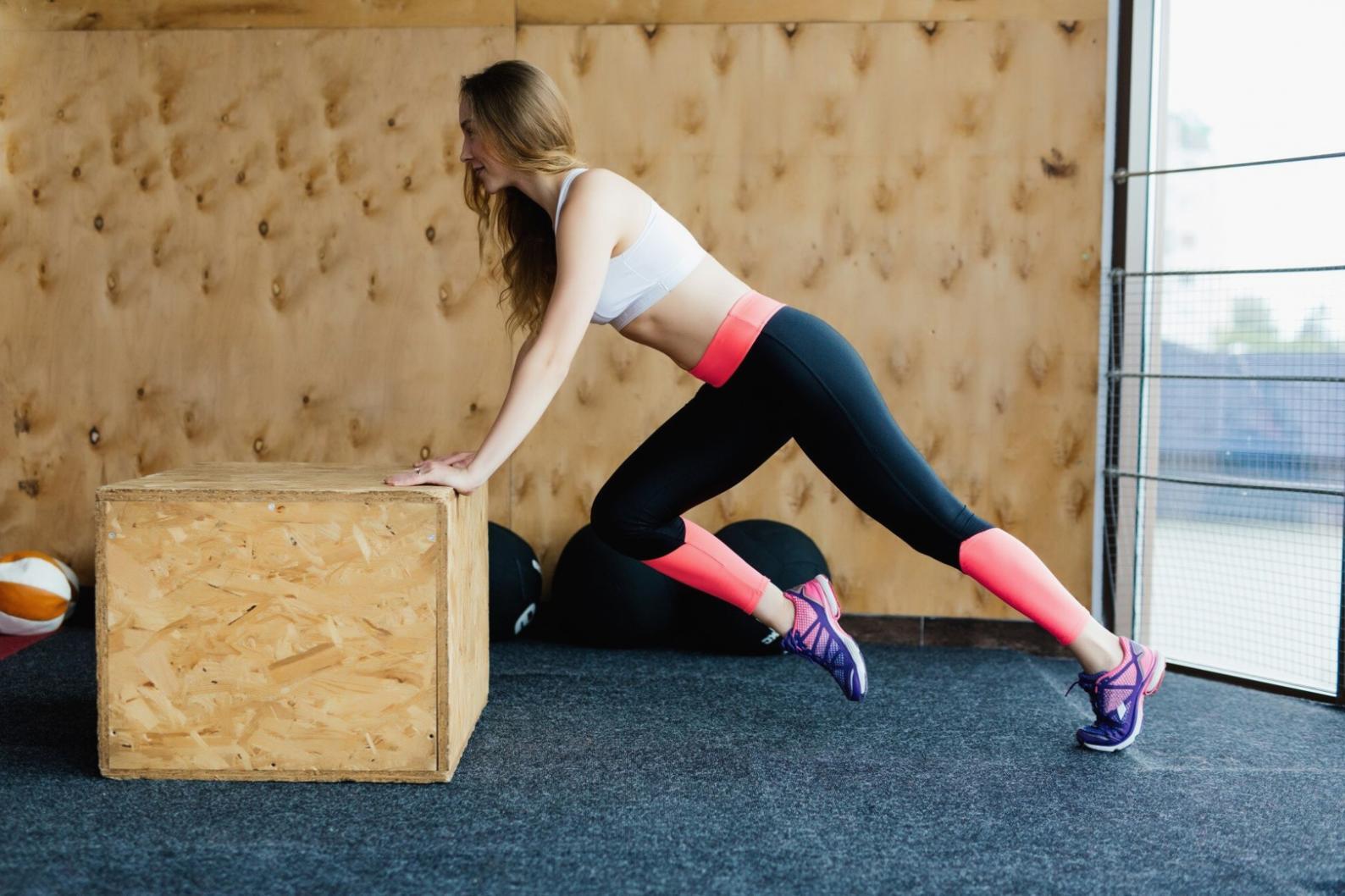 CrossFit athlete reviewing proper form fundamentals during training session